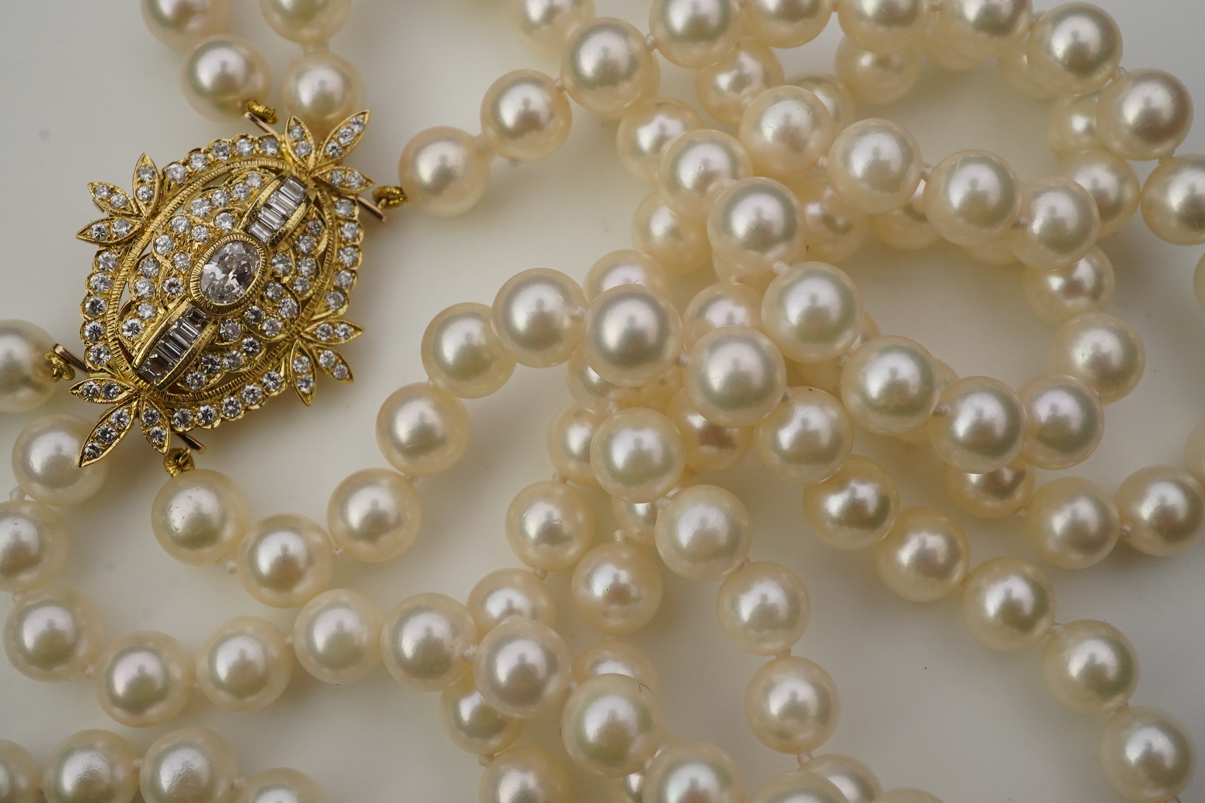 A cultured pearl and diamond necklace/brooch